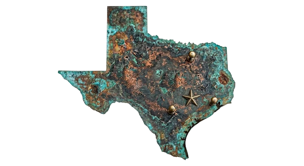 Weathered copper map of Texas with a brass star marking La Grange